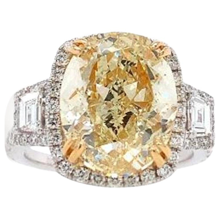 Lot: 8102 GIA Oval 6.01 Cts. Fancy Light Yellow Vs2 Diamond Set in 18k Halo Ring For Sale