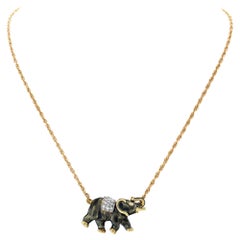 Vintage Elephant necklace in 14k gold with 0.25 carats in diamond accents G-H color