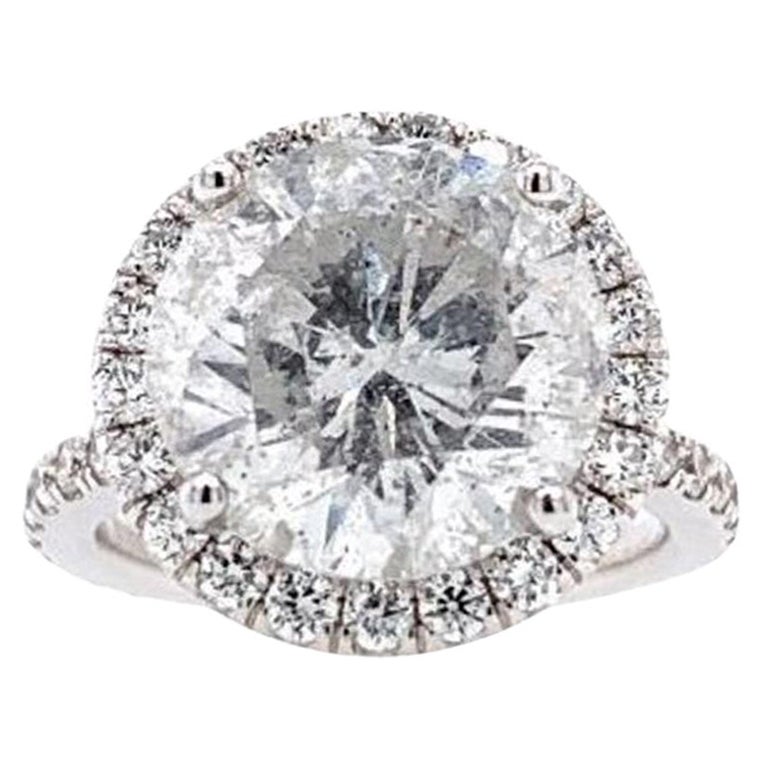 Lot: 7754 GIA Certified Round 6.62cts Ii3 Diamond Set in 18k Halo Ring