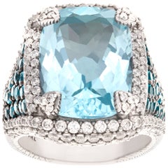 Judith Ripka ring with faceted blue topaz and white cz in sterling silver