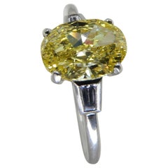 GIA Certified 1.4 Cts Fancy Vivid Yellow Oval Diamond Ring. Strong Color. 