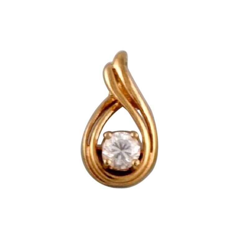 Scandinavian jeweler. Pendant in 14 carat gold adorned with semi-precious stone. For Sale