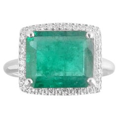 Platinum Emerald Ring with Diamond Halo