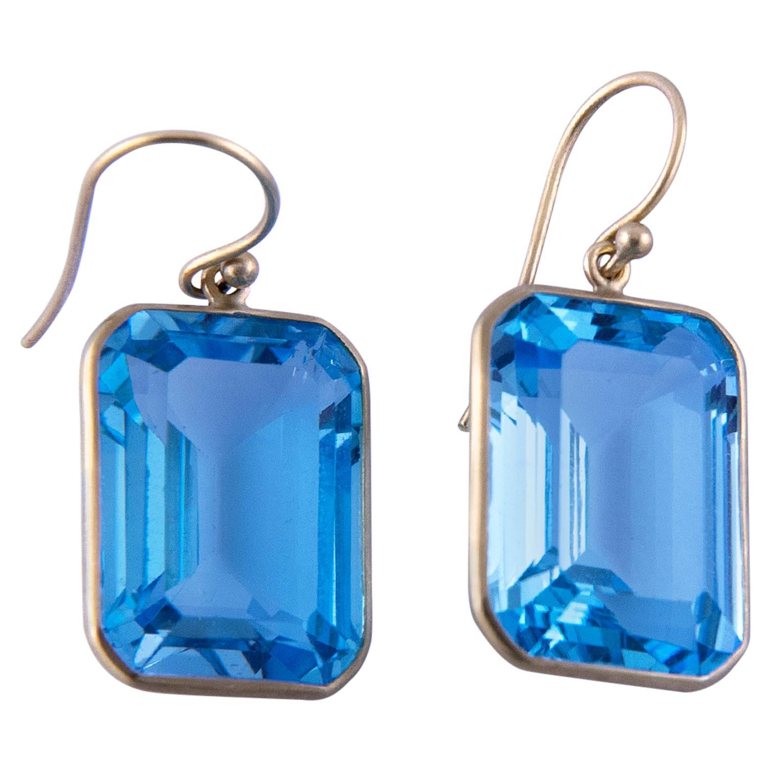 Contemporary Emerald Cut Blue Topaz Gold Drop Earrings