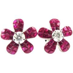 Stunning Invisibly Set Rubies With Prong Set Diamond Center Gold Post Earrings