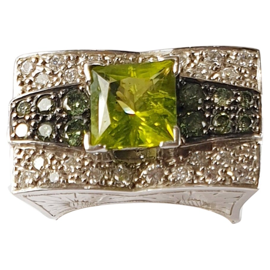 Green and White Diamonds Wiht Tsavorite Center Stone in 18 Karat White Gold Ring