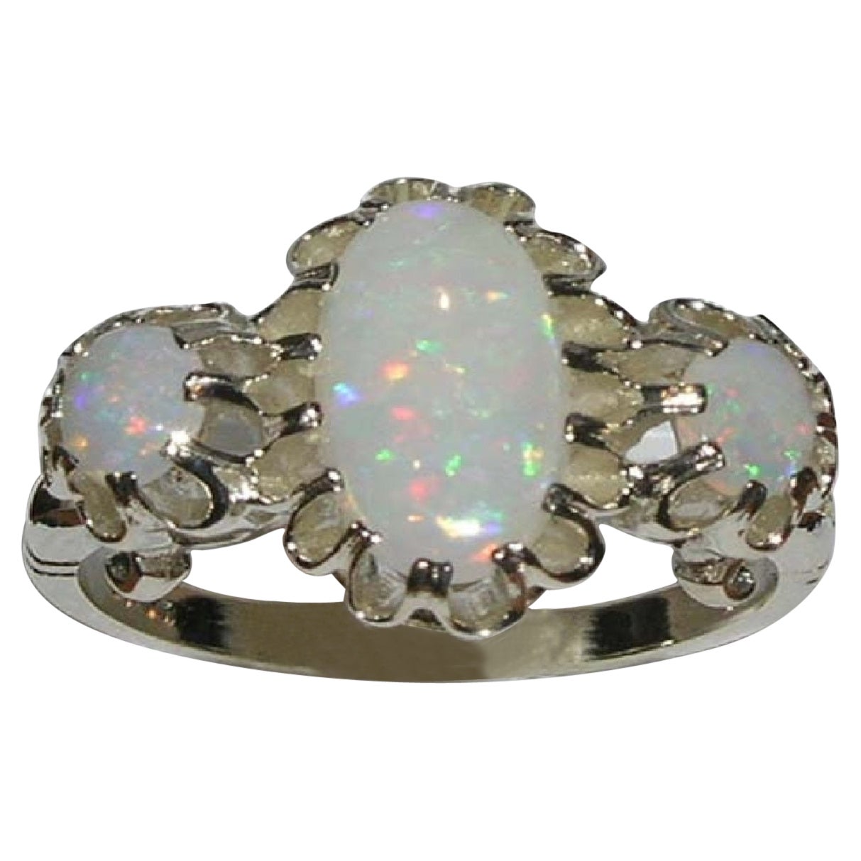 For Sale:  English 9K White Gold Large Elongated Colourful Opal Trilogy Ring