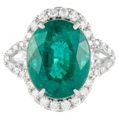 Alexander 8.50ct Oval Emerald with Diamond Three Stone Halo Ring 18 Karat Gold