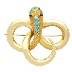 Antique 0.37 Carat Turquoise and Garnet Yellow Gold Snake Brooch