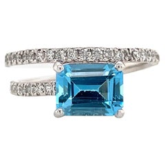 Platinum Blue Topaz Diamond Crossover Ring 1.31 Carats