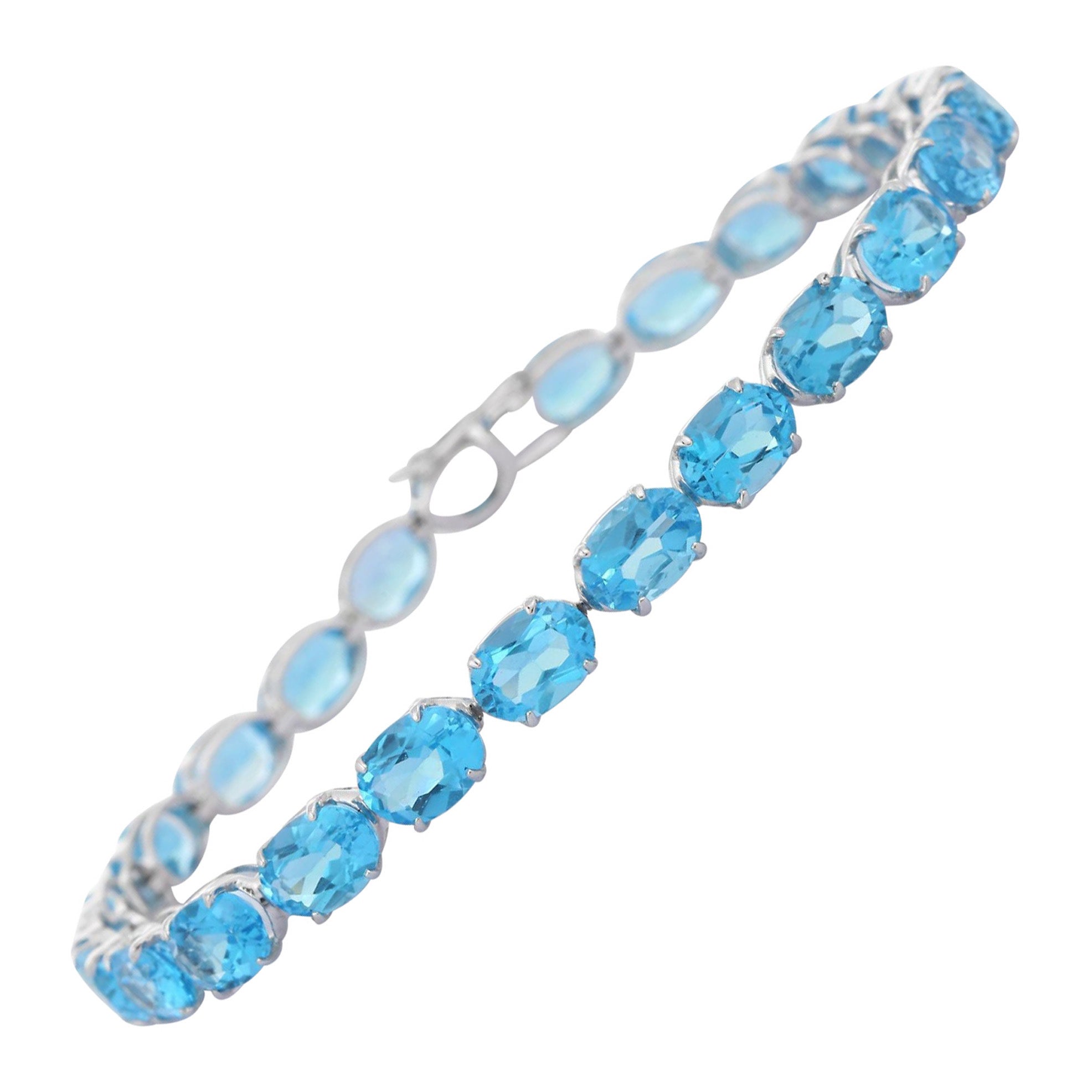 9ct white gold 9x7mm oval blue topaz bracelet - Jewellery from Mr Harold  and Son UK