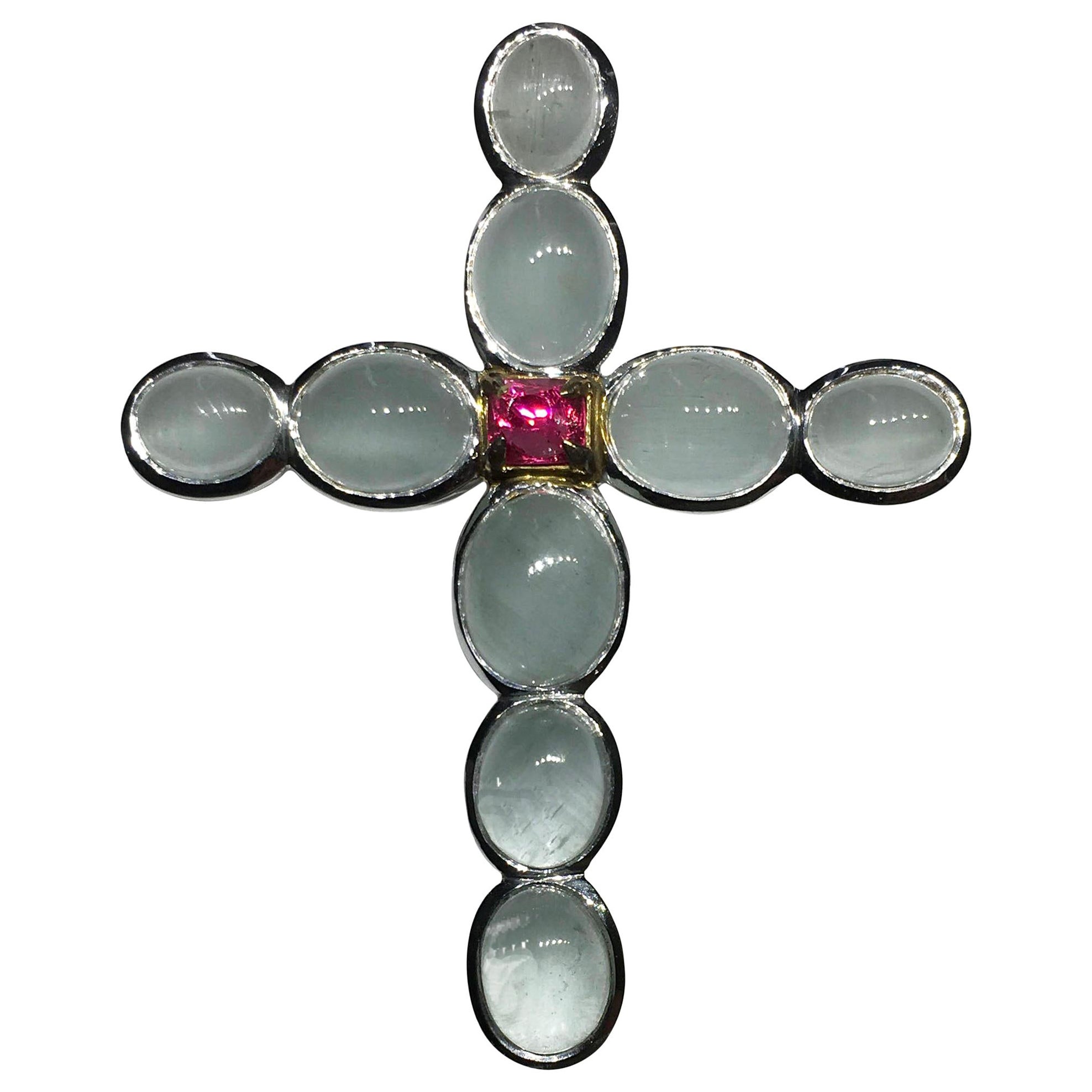 A Silver Cross Pendant set with Milky Aquamarine & an Unheated Pink Sapphire. For Sale