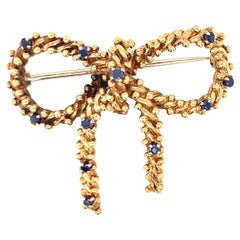 Sapphire Bow 18k Yellow Gold Brooch by Tiffany & Co., circa 1970s