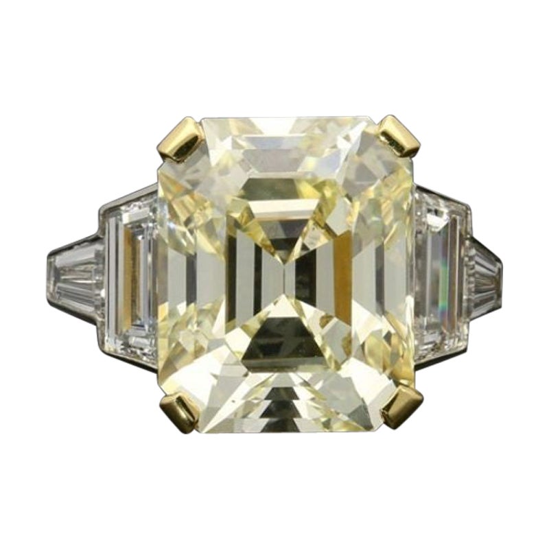 Hancocks 8.73ct Vintage Emerald-Cut Pale Yellow Diamond Ring Diamond Shoulders For Sale