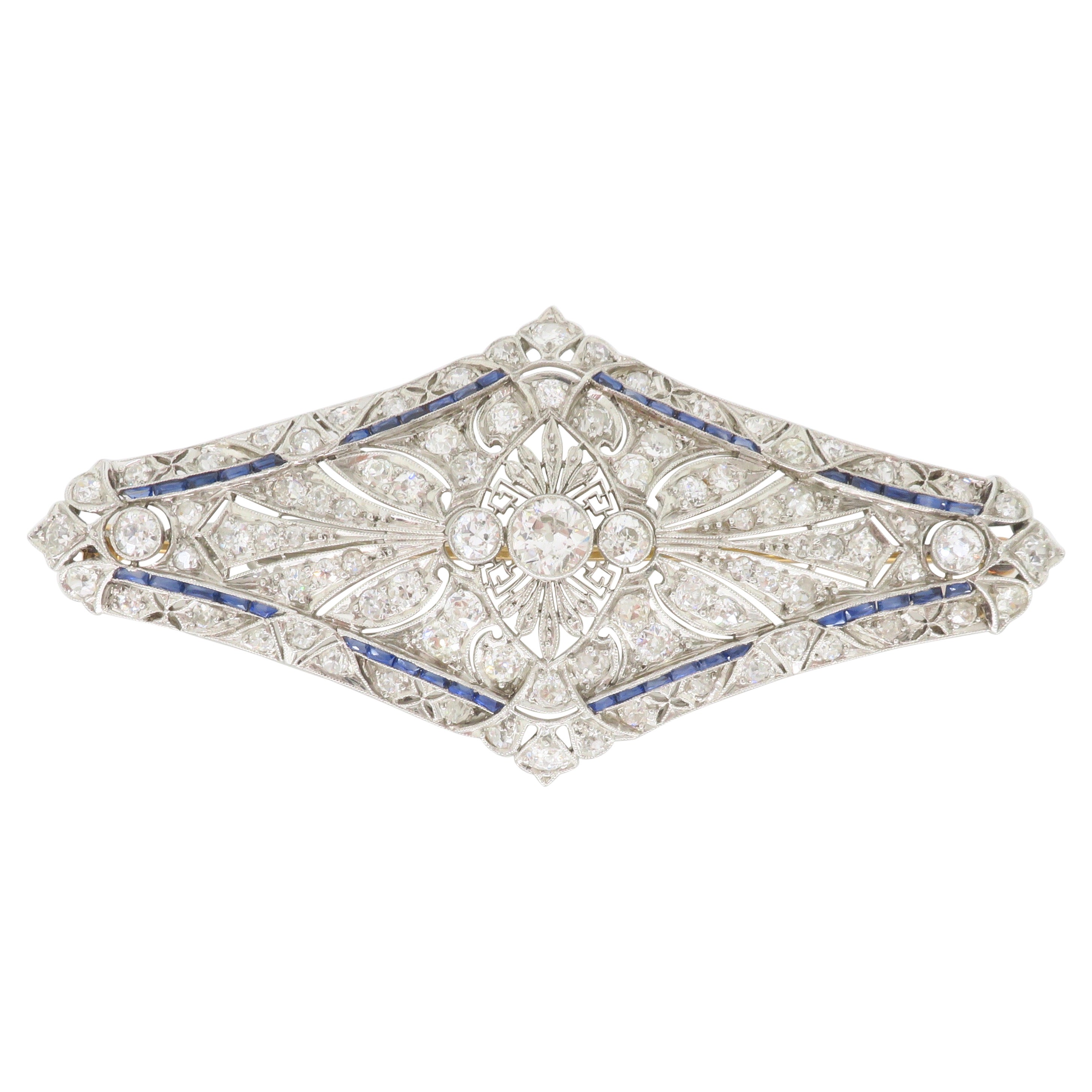 Vintage Brooch Made in Platinum with Diamonds & Blue Sapphires For Sale