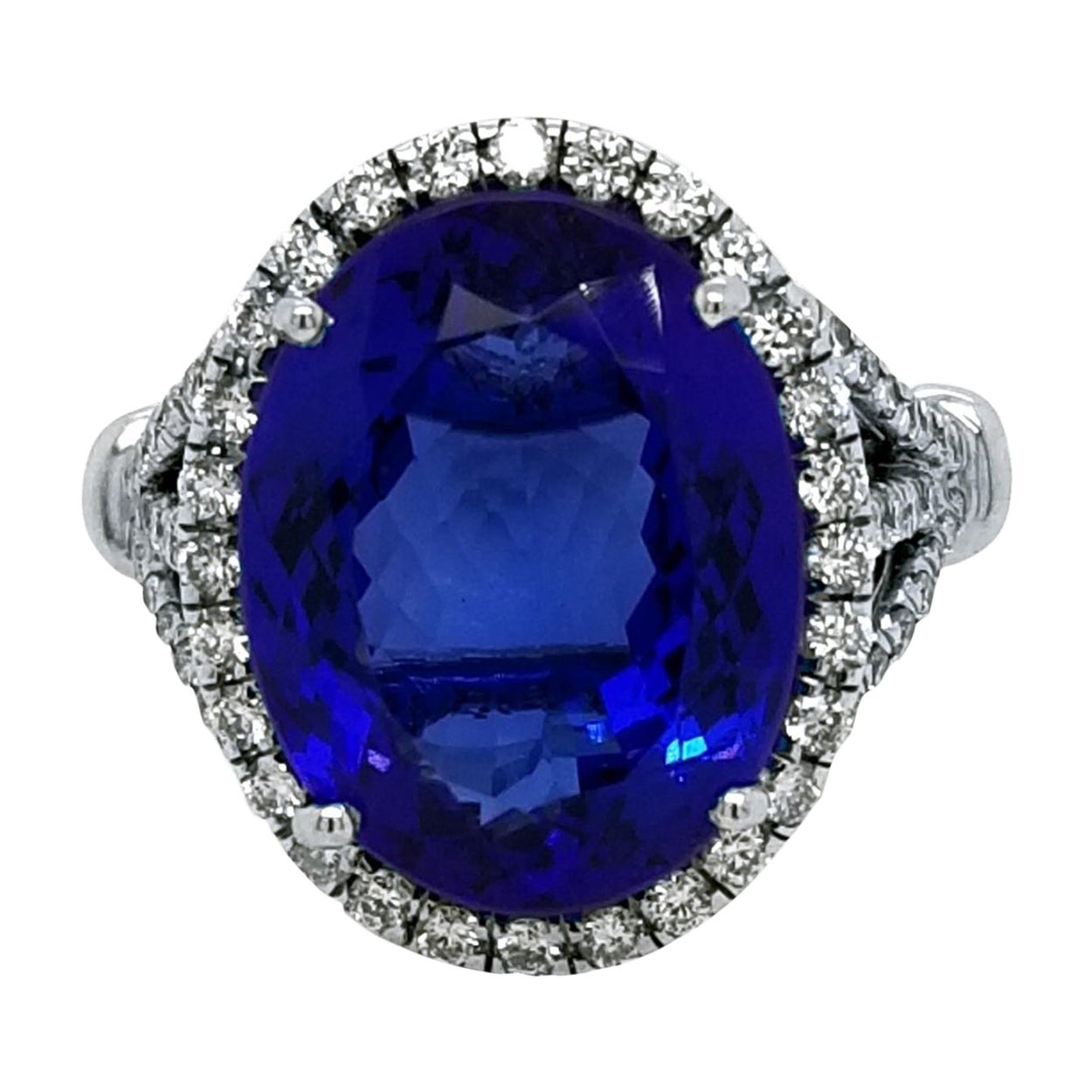 9.38 Carat Oval Tanzanite Split Shank Pave Set Engagement Ring with Halo For Sale
