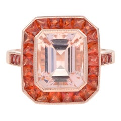 Ring aus 18 Karat Roségold mit Morganit im Smaragdschliff und orangefarbenem Saphir-Halo