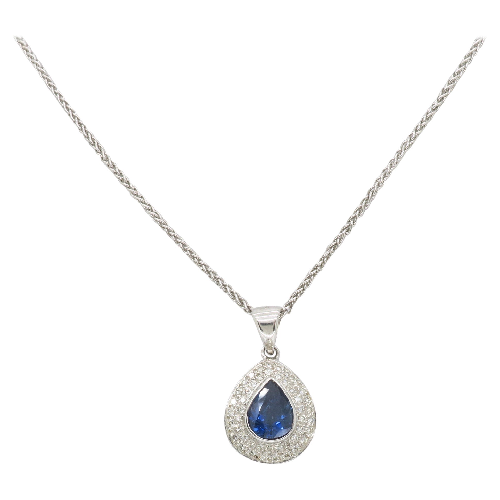 Blue Sapphire & Diamond Halo Pendant Necklace in 18k For Sale