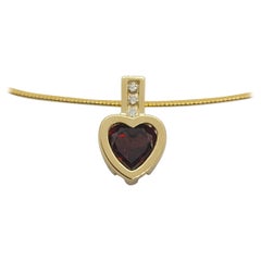 Ciondolo in oro giallo 14kt con diamante e granato a forma di cuore (0,07cttw) da 2,3 grammi