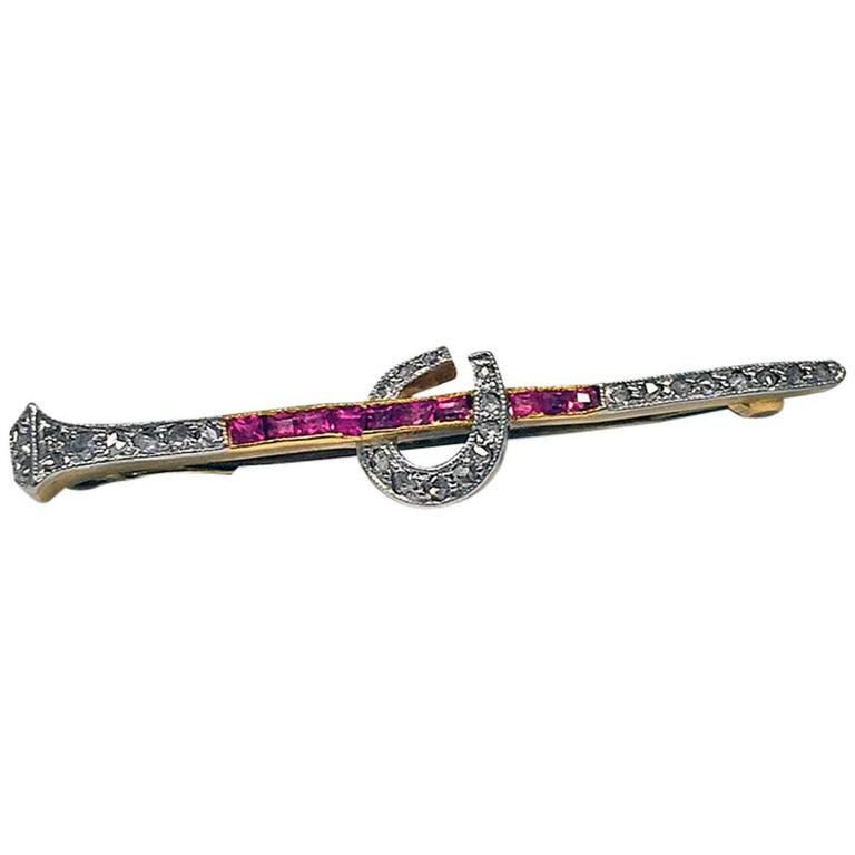 1920s Art Deco Ruby Diamond Gold Platinum Horseshoe Nail and Stirrup Pin Brooch at 1stDibs