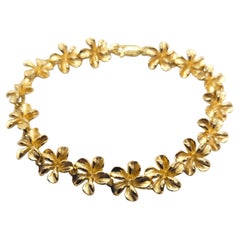 Bracelet Plumeria en or jaune 14 carats, 8,5 grammes, fermoir mousqueton