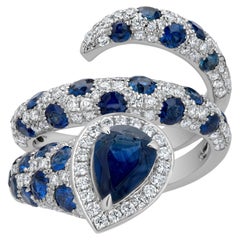 Nigaam 4,49 ct. pt. Bague tourbillon en or blanc 18 carats avec diamants et saphirs bleus