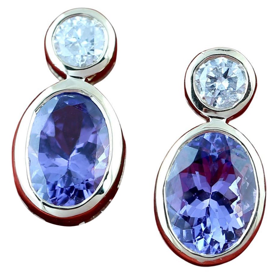 Oval Shaped Blue Tanzanite Stud Earrings with Diamonds Made in 18k Gold For Sale