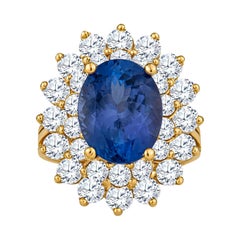 7.26 Carat Oval Cut Tanzanite with 4.00ctw Diamonds 18 Karat Yellow Gold Ring