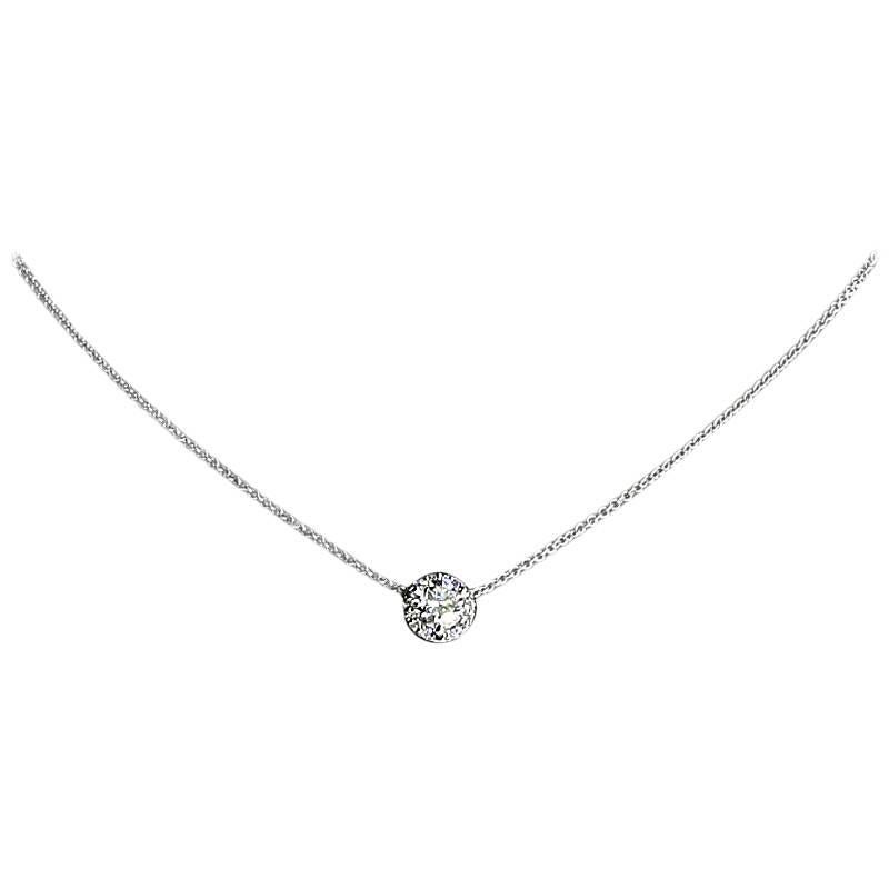Simple yet elegant & beautiful would be the best way to describe this stunning pendant! It features a sparkly round brilliant diamond weighing .30 carat that grades as H/SI1 in quality. The diamond is 3 prong set in the middle of a white gold,