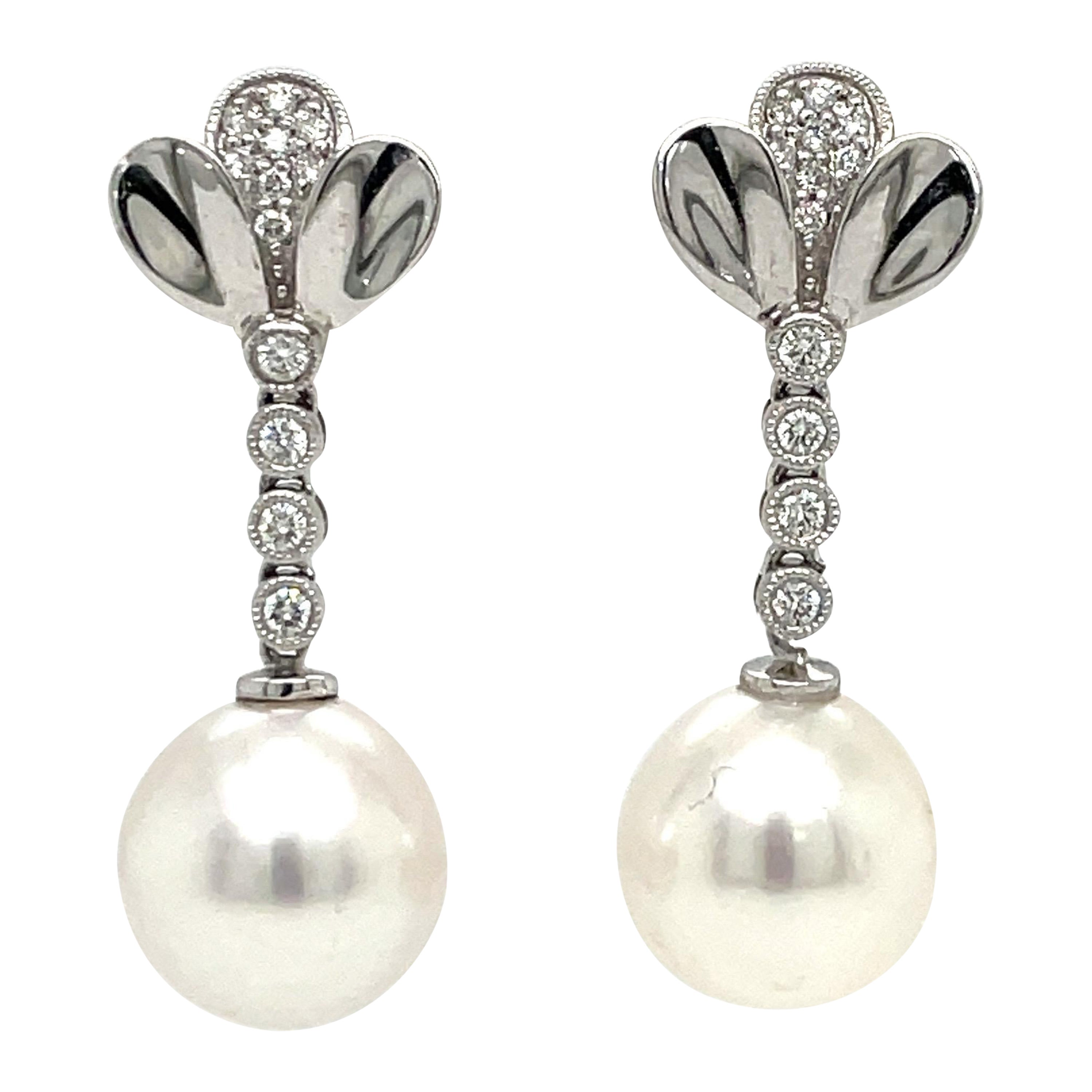 Round Cut 14 Karat White Gold Petal Diamond South Sea Pearl Drop Earrings 0.24 Carats For Sale
