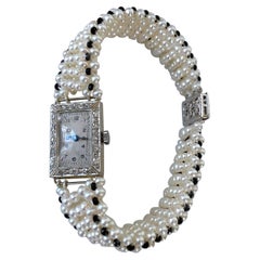 Marina J.: 18 Karat Vintage-Uhr mit Diamanten, Perlen und schwarzem Spinell