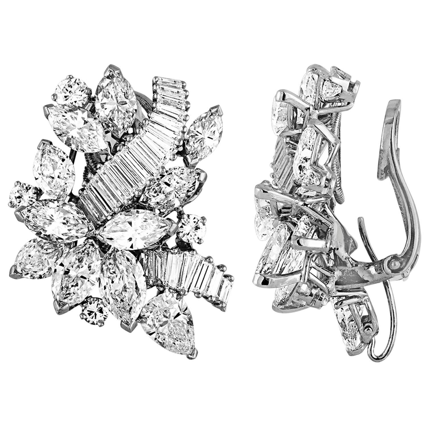 Elegant pair of Earring made from Platinum and has different shapes of Diamonds creating The Royal look. The pair is combination of Round Brilliants, Marquises, Pear Shapes and Baguettes - and all are White Diamonds. The diamonds are estimated to be