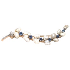 Antique Circa 1890s Victorian Natural Pearl and Sapphire Brooch in 14 Karat Gold