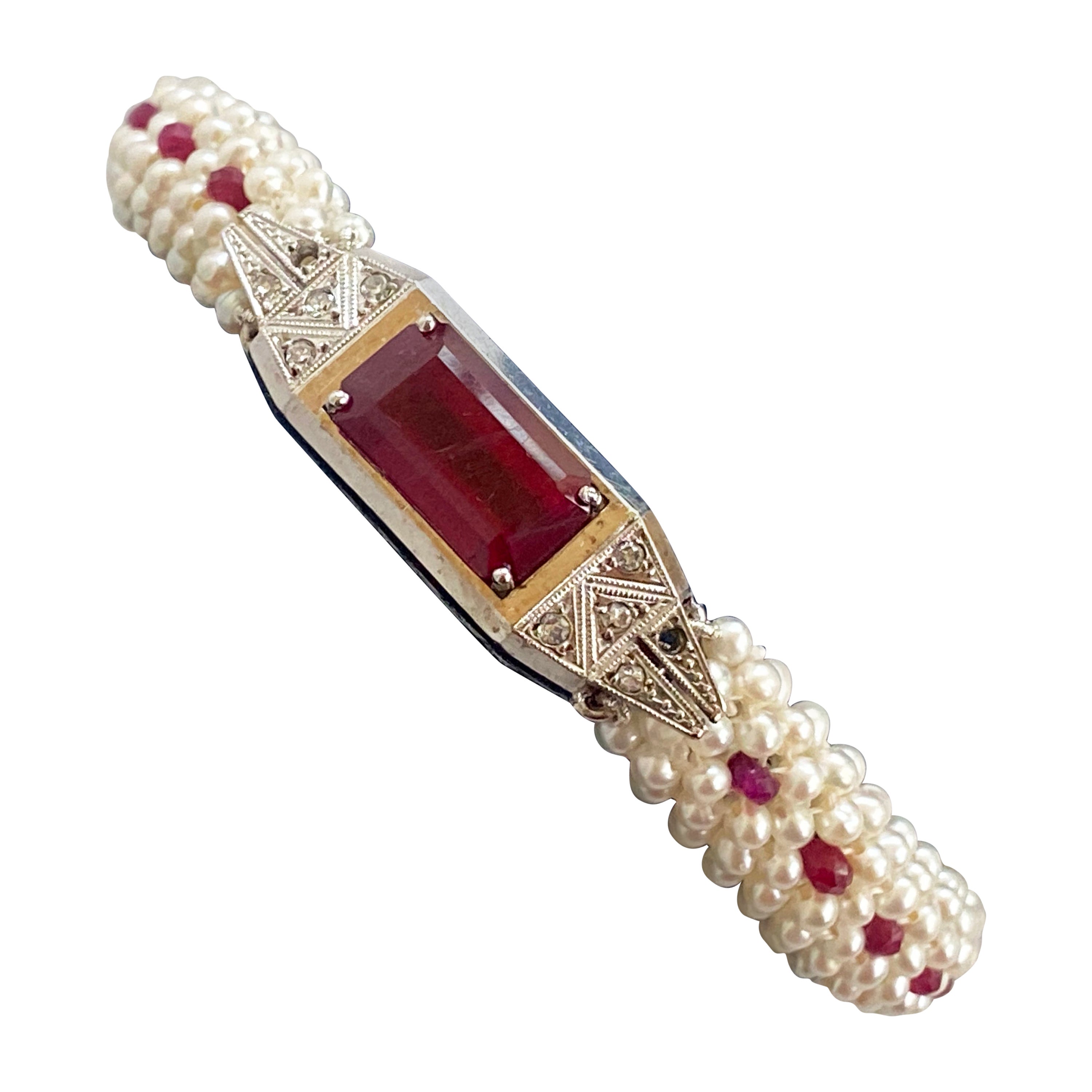Gorgeous One of A Kind piece by Marina J. This bracelet features a lovely Antique solid 14k White Gold Diamond encrusted Watch, that has been repurposed into a stunning Ruby set centerpiece. The brilliant and bright red rectangular Ruby is adorned