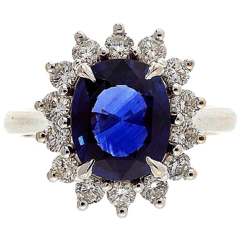 Oval Royal Blue Sapphire Diamond Halo Gold Ring