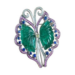 Art-Deco 42.77 Carat Carved Emerald, Coloured Sapphire and Diamond Brooch