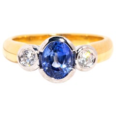 Vintage Circa 1990s 18 Carat Gold Oval Sapphire and Diamond Three Stone Ring