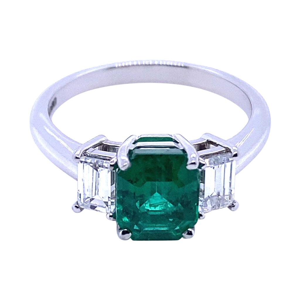 1.65 Carat Zambian Emerald and Diamond Three Stone Platinum Engagement Ring For Sale