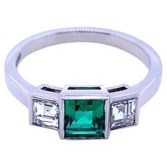 0.58 Carat Columbian Emerald and Diamond Three Stone Platinum Engagement Ring