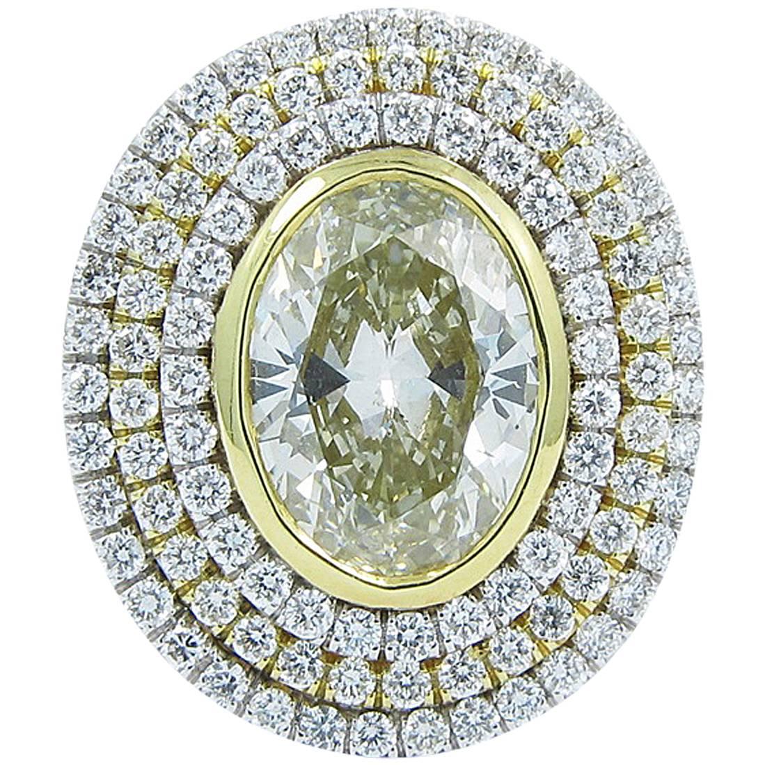 3.12 Carat Fancy Color Oval Diamond Gold Triple Halo Ring  For Sale
