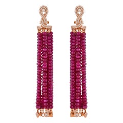 Boucles d'oreilles pendantes en or rose 14 carats et rubis