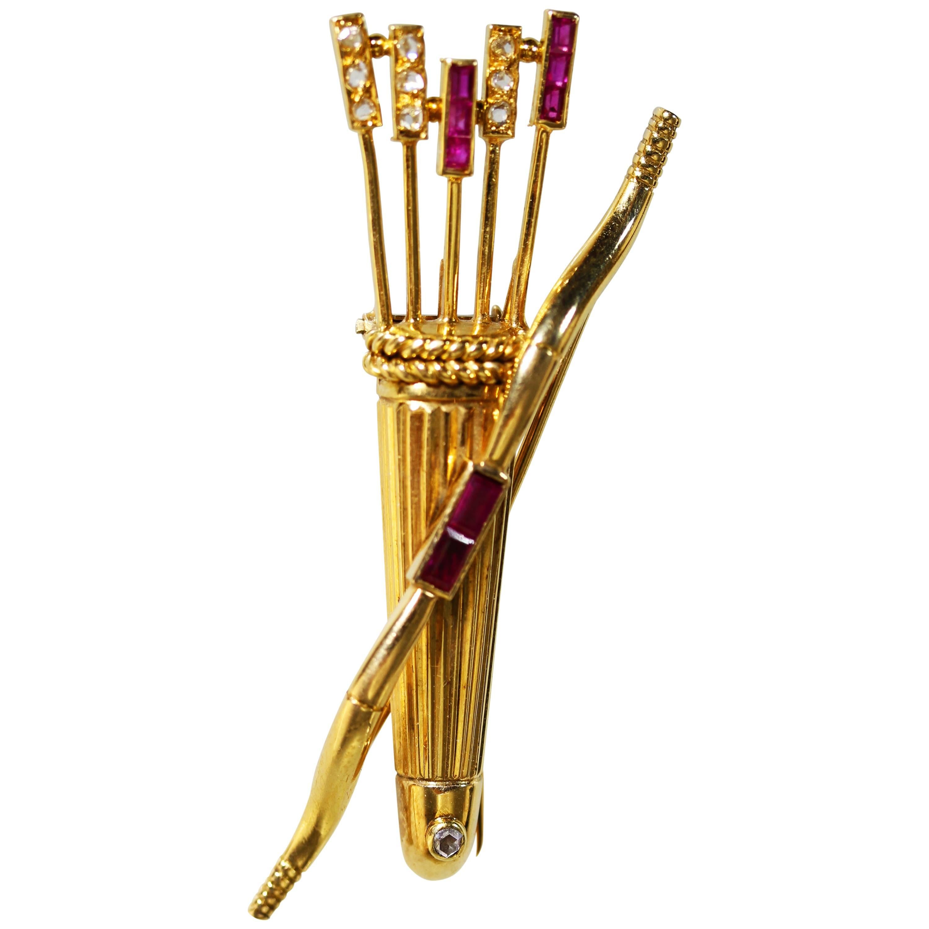 Cartier Broche en or avec nœud et flèche en rubis et diamants, années 1940