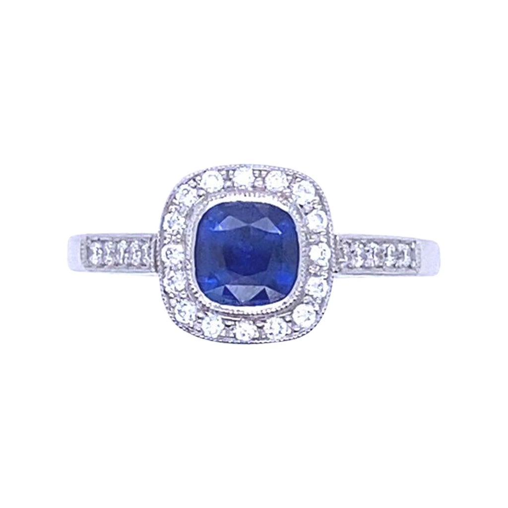 0.68 Carat Sapphire and Diamond Cluster Platinum Engagement Ring For Sale