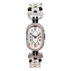 Antique Art Deco Platinum Diamond Pearl and Onyx Ladies Mechanical Wristwatch