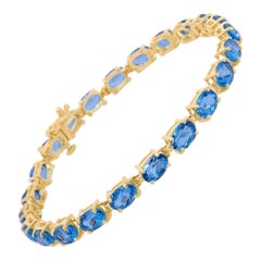 10K Yellow Gold and 4 Prong Set Blue Topaz Link Tennis Bracelet