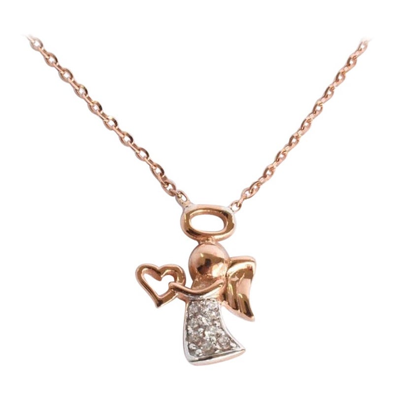 Angel Charm Pendent Necklace is made of 18k solid gold available in three colors of gold, White Gold / Rose Gold / Yellow Gold.

Natural genuine round cut diamond, each diamond is hand selected by me to ensure quality and set by a master setter in