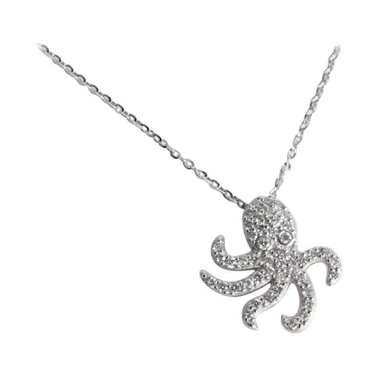 Delicate Dainty Octopus Charm Necklace with natural diamond set in 18k solid gold available in three colors, White Gold / Rose Gold / Yellow Gold.

Natural genuine round cut diamond each diamond is hand selected by me to ensure quality and set by a