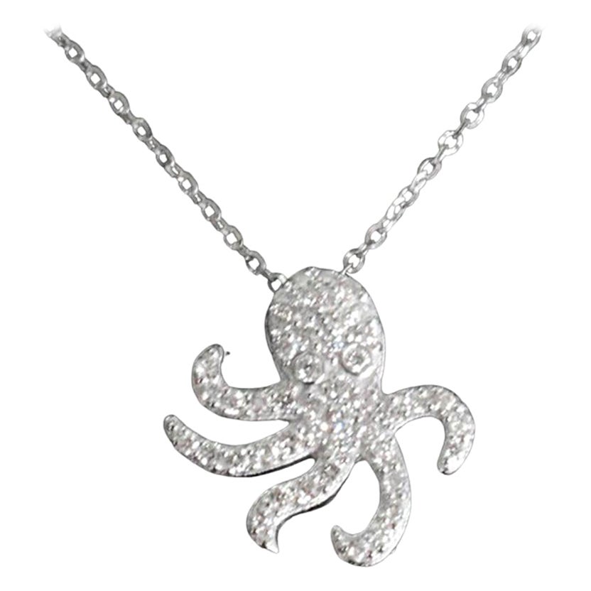 Delicate Dainty Octopus Charm Necklace with natural diamond set in 14k solid gold.
Available in three colors of gold: White Gold / Rose Gold / Yellow Gold.

Natural genuine round cut diamond each diamond is hand selected by me to ensure quality and