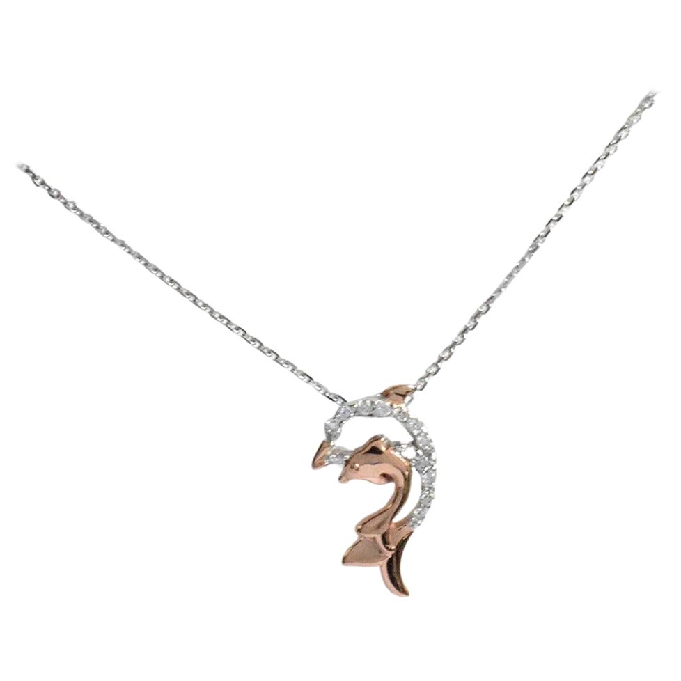 Delicate Dainty Fish Charm Necklace with natural diamond set in 14k solid gold available in three colors of gold.
(White and Rose Gold), (White and Yellow Gold), (Pure White Gold)

Lightweight and gorgeous natural genuine round cut diamond. Each