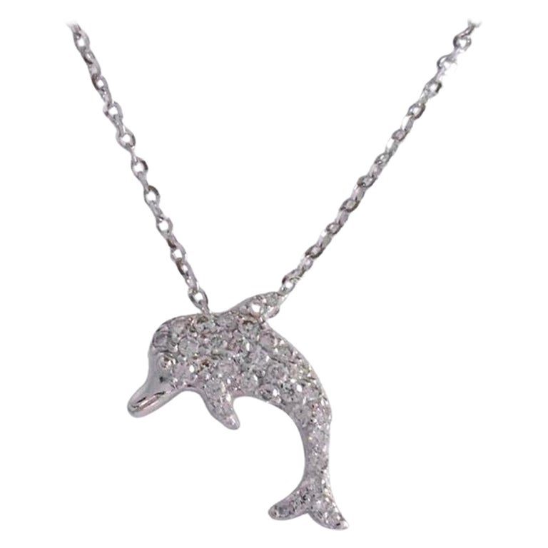 Delicate dainty dolphin charm necklace with natural diamond is made of 18k solid gold.
Available in three colors of gold: White Gold / Rose Gold / Yellow Gold.

Lightweight and gorgeous natural genuine round cut diamond. Each diamond is hand